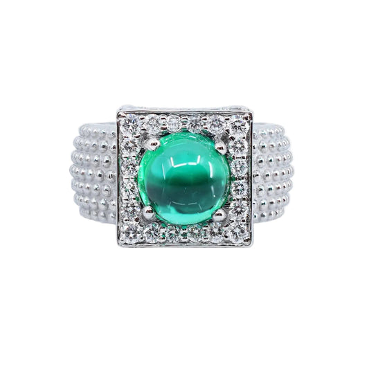 18K white gold ring with a emerald green gemstone on a white background