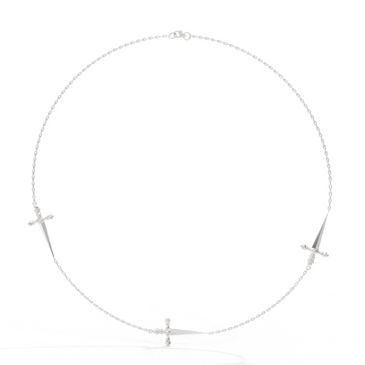 A necklace with three sword-shaped pendants, each adorned with small round diamonds, displayed against a white background.
