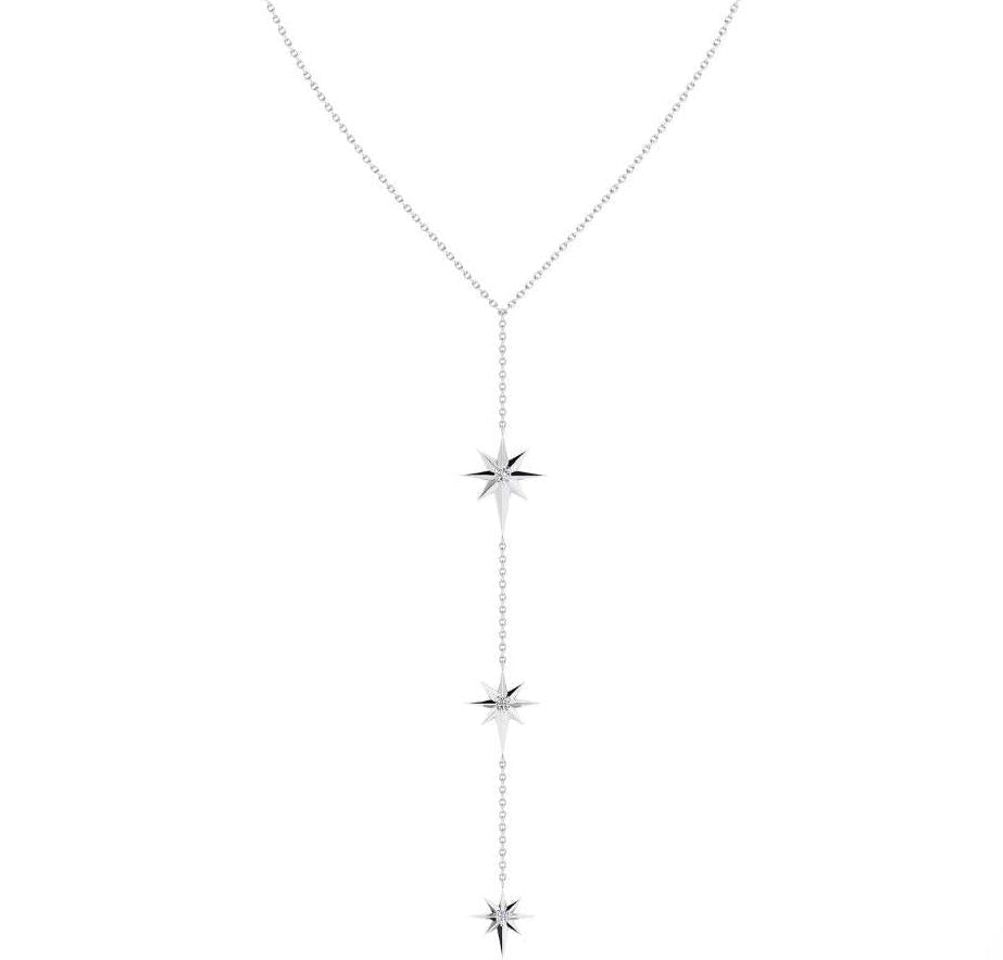 A delicate silver-toned necklace with a teardrop-shaped chain and three vertical starburst charms, shown on a plain white background.