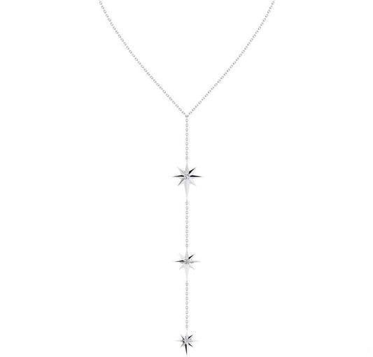 A delicate silver-toned necklace with a teardrop-shaped chain and three vertical starburst charms, shown on a plain white background.